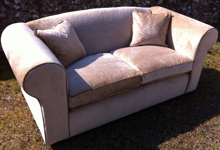 Beautifully reupholstered 2 seater sofa covered wtih Swaffers velvet